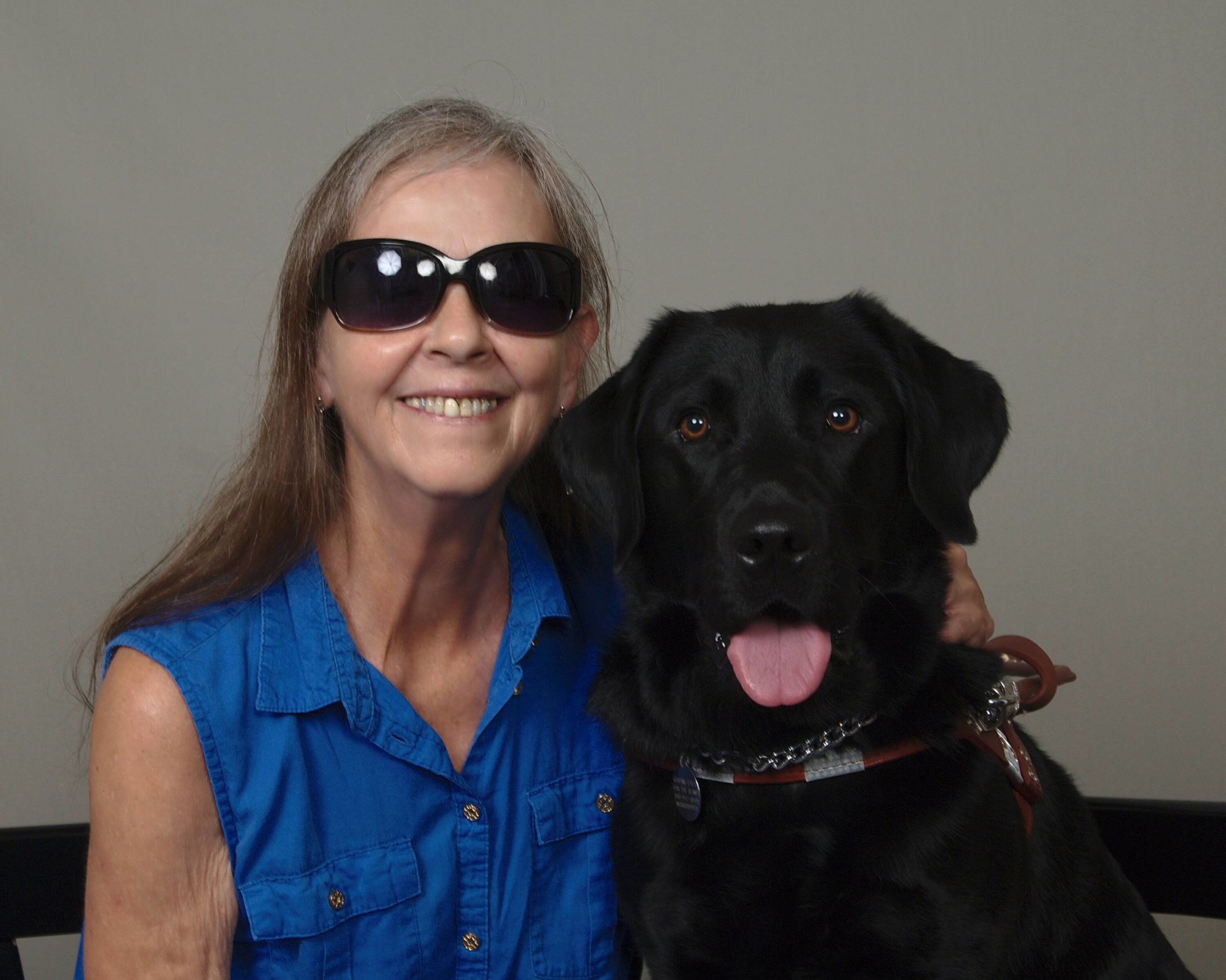 Sandra and guide dog Wafer smile for a close up photo