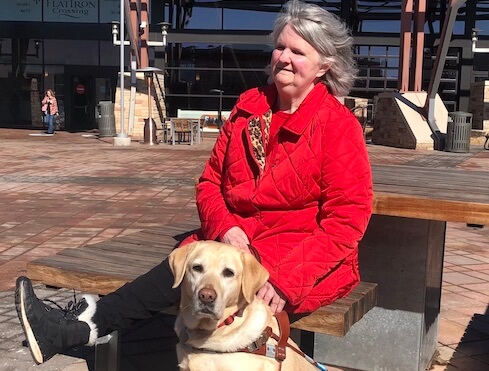 Sherry and Shani soak up some winter sun on a bench
