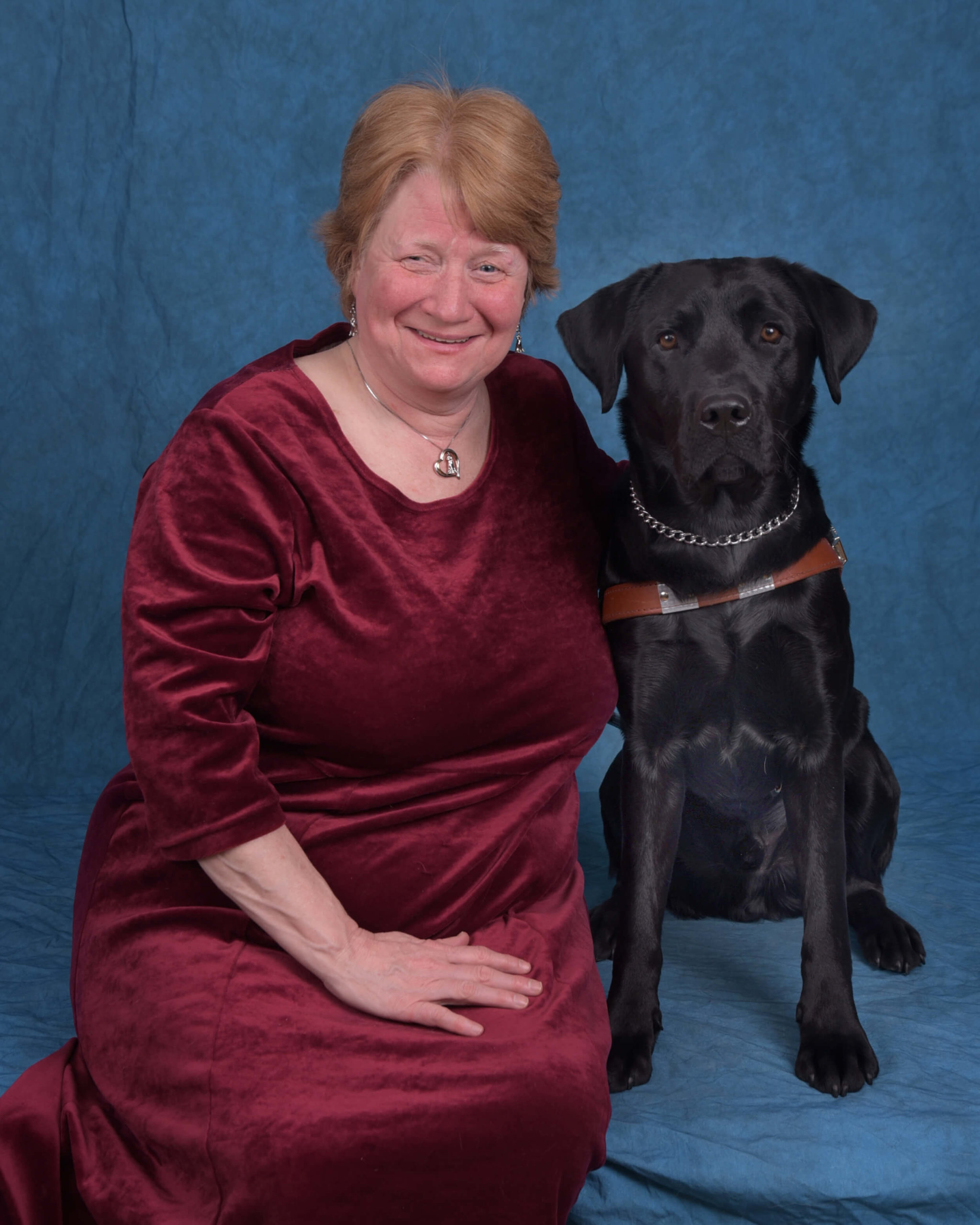 Graduate Theresa and guide dog Olson