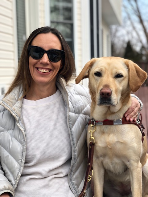 graduate Tracey and yellow Lab guide Triscuit