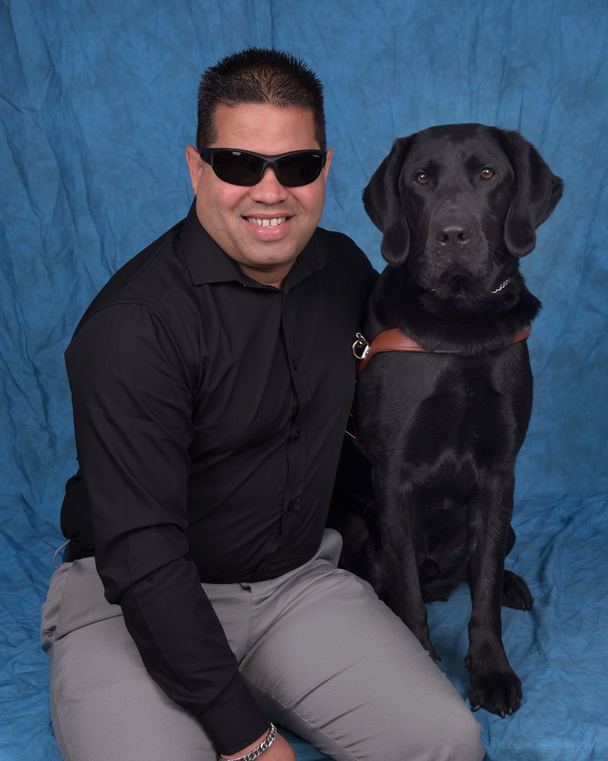 Graduation photo of July graduate Willi and guide dog Kendall