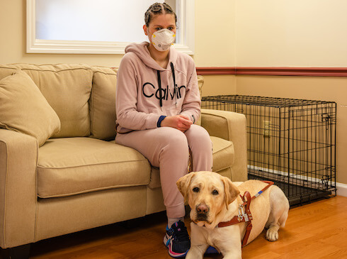 Graduate Wallezka and guide Sloan take a quick rest during training