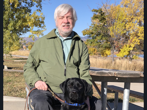 Graduate William and guide dog Caper