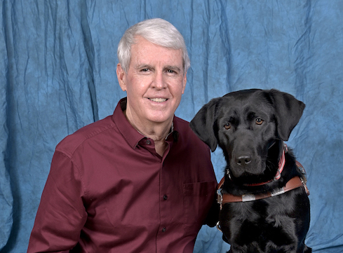Graduate Bill and black Lab guide dog Trudy
