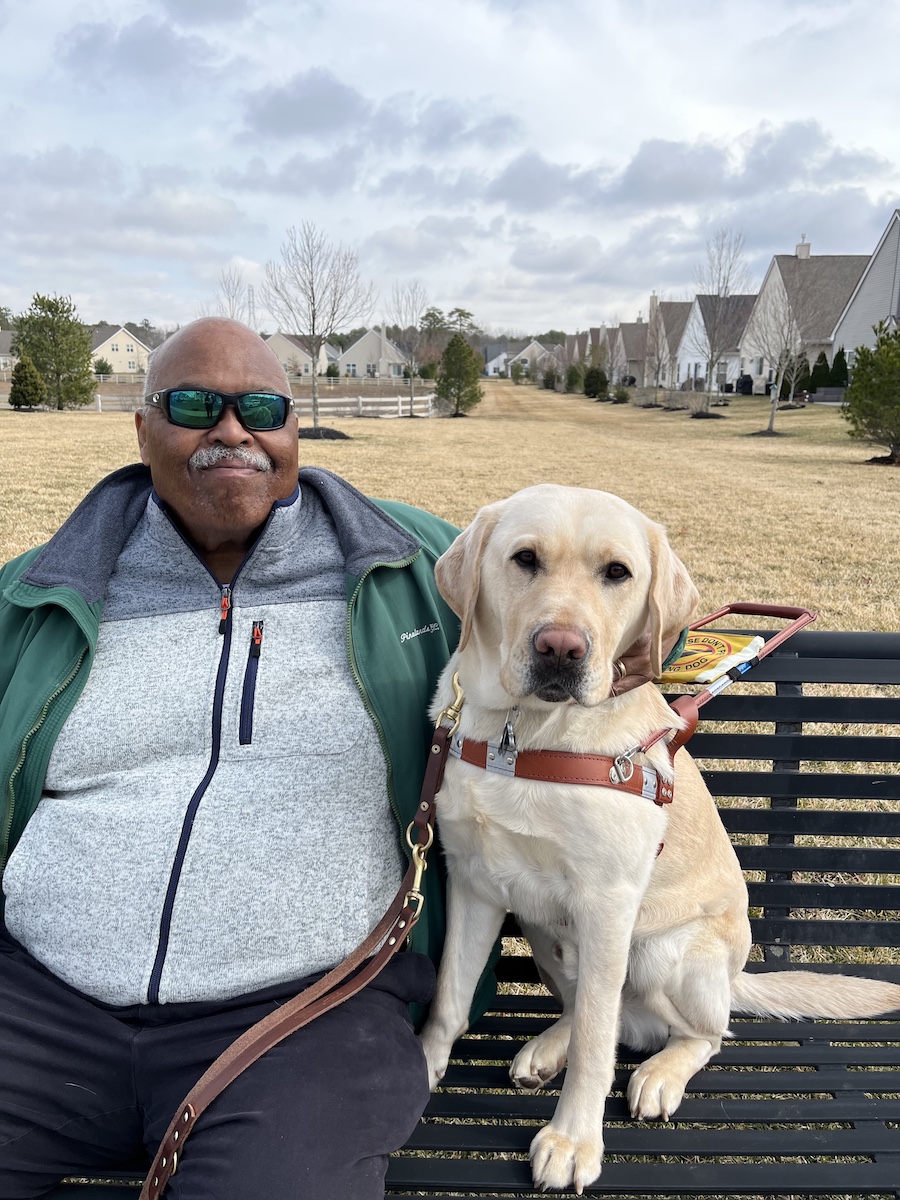 Graduate Zed and yellow Lab guide dog Verdell
