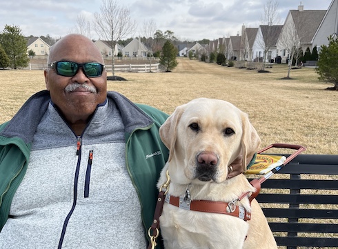 Graduate Zed and yellow Lab guide dog Verdell