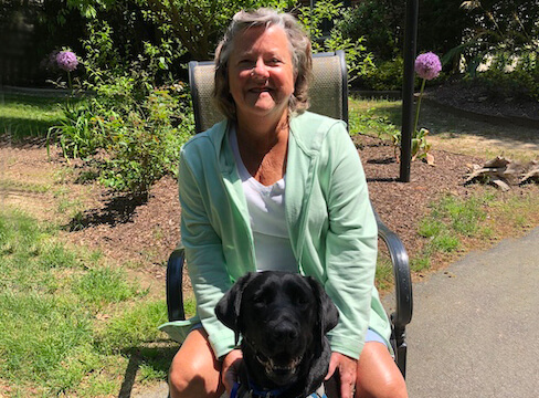 Graduate Alexis and black Lab guide dog Kathleen
