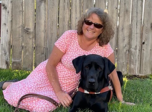 Graduate Carmen and black Lab guide dog Tommy