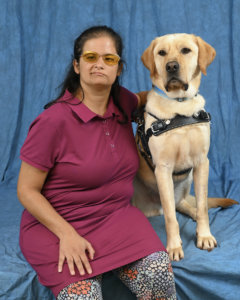 Graduate Caterina and yellow Lab guide dog Filo
