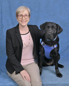 Graduate Susan and black Lab guide dog Nixie