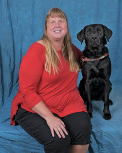 Graduate Tonia and black Lab guide dog Sassy