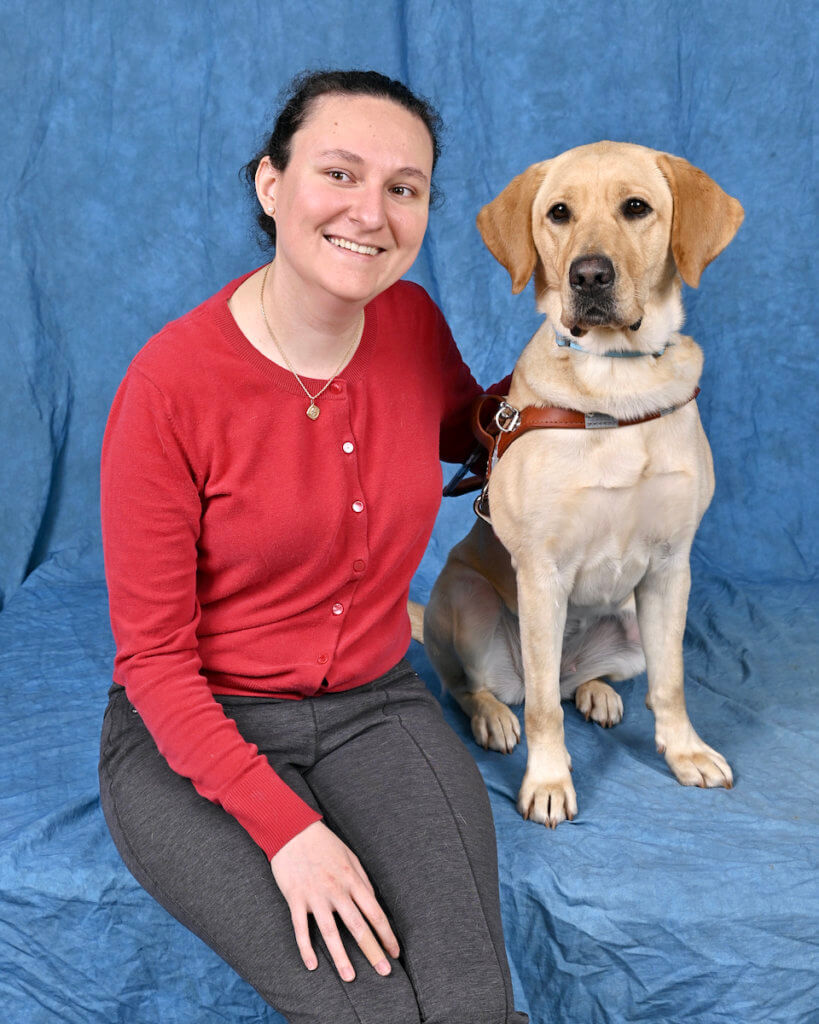 Graduate Daniela and yellow Lab guide dog Leilani