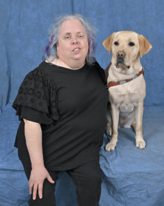 Grad Gwendolyn and yellow Lab guide dog Julie