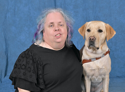 Grad Gwendolyn and yellow Lab guide dog Julie