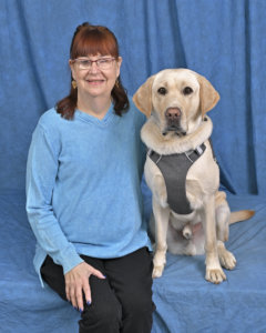 Elizabeth and yellow lab guide Vernon in their portrait