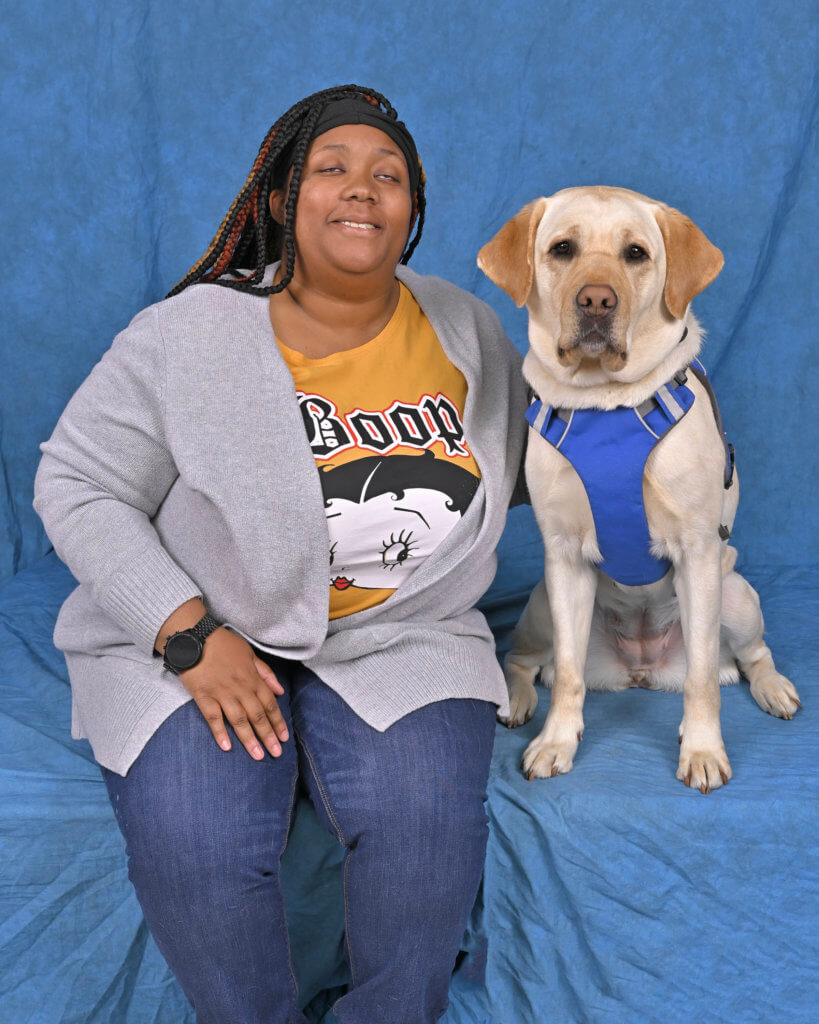 Briasa and her yellow Lab guide dog Journey