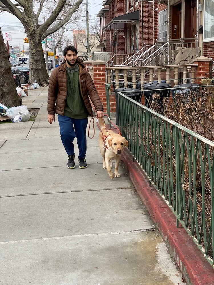 Jake leads Ibraheem past many obstacles on a Staten Island street