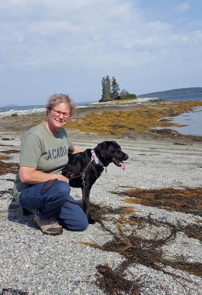Acadia and raiser Marci have a quiet moment at Acadia National Park