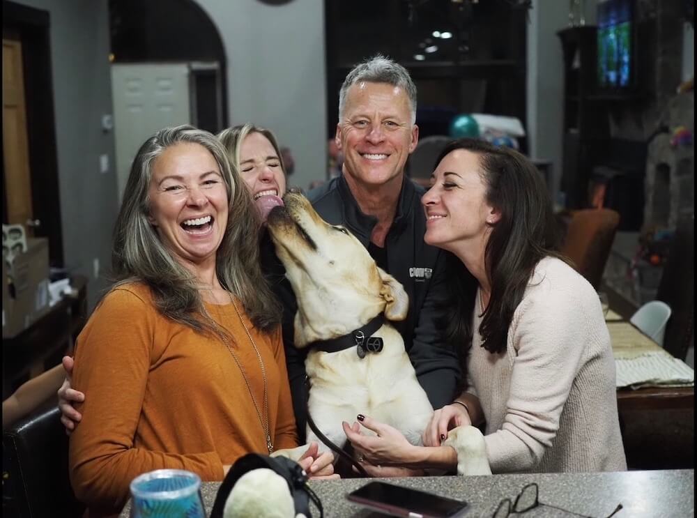 yellow Lab Presley excited to share family photo with raisers