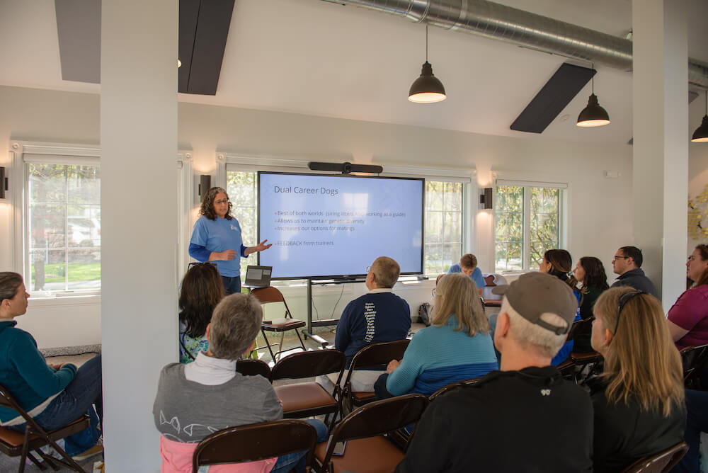 Clover Williams talks Genetics with a presentation on the screen