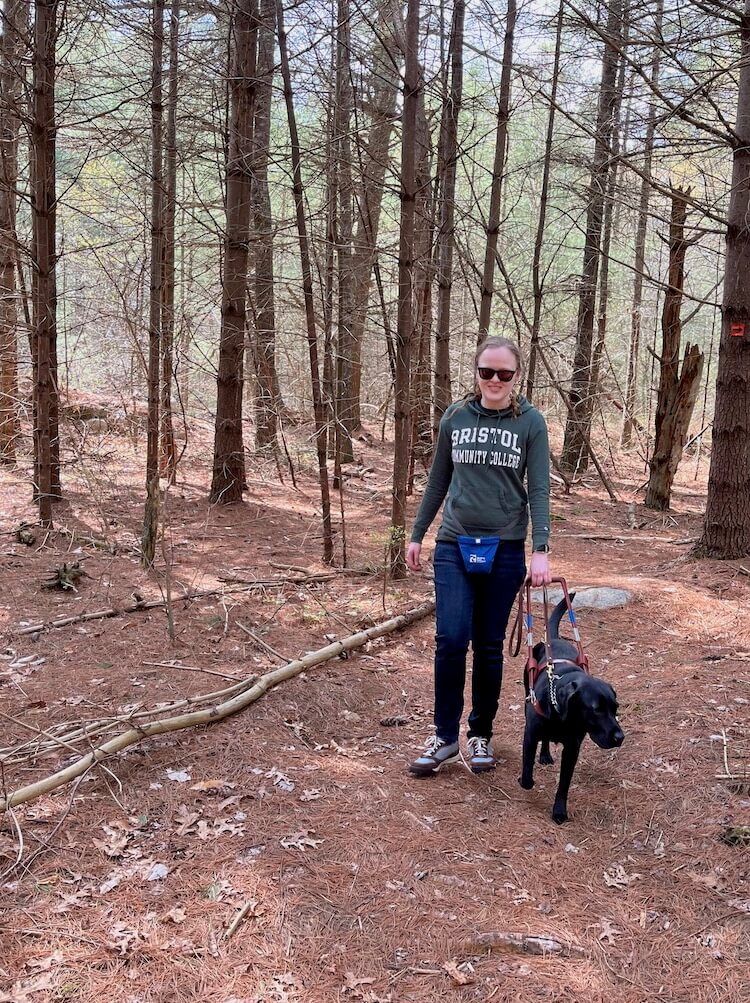 Maggie leads Tiffani safely through wooded trails at home 