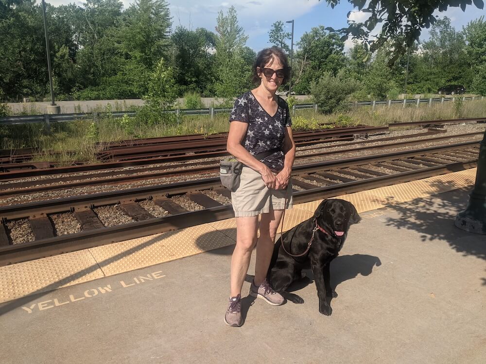 black lab Francis with raiser Carrie