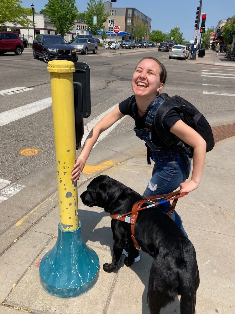 Rachel exudes pure joy as she and Chris practice targeting on a traffic pole on the sidewalk