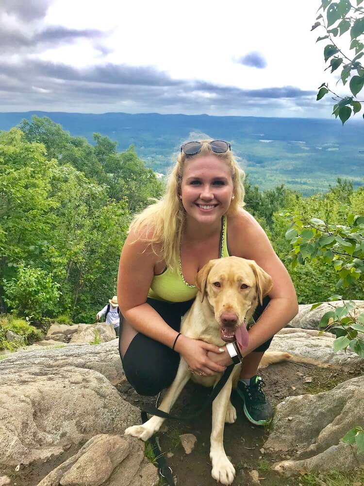 Pepper at the top of Mt. Monadnock with raiser Morgan