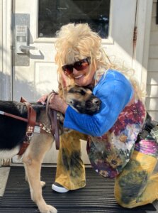 Deborrah and her German Shepherd guide Dixie share a loving hug after a training walk