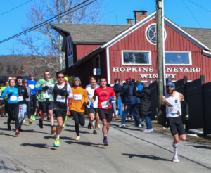 Runners take off at the start of the Polar Bear Run with the Hopkins Winery in the background