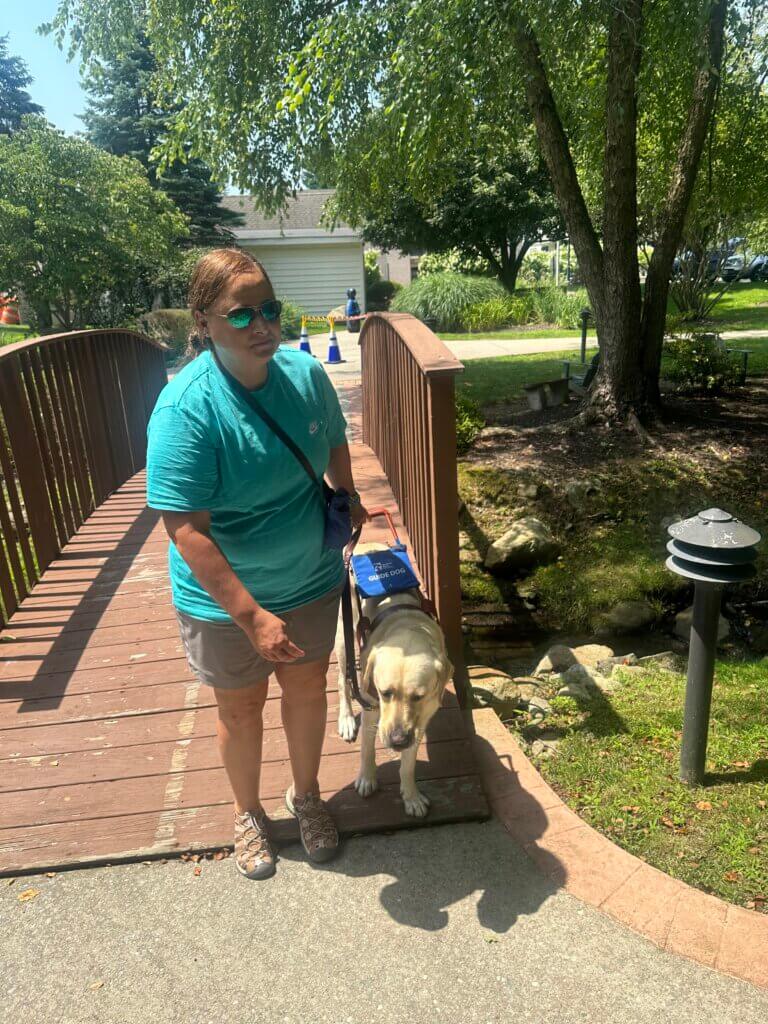 Aimee and Bryna cross over the Nature Path bridge at the Training School campus