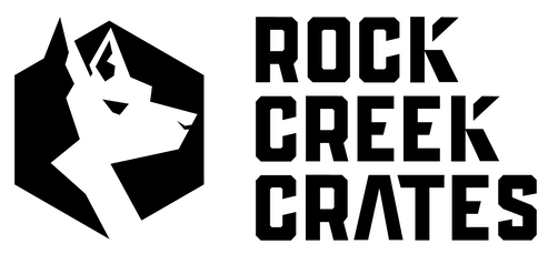 A black graphic with the silhouette of a dog head cut into it with ROCK CREEK CRATES written to the right