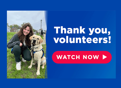 A young woman kneeling beside a yellow Lab. On a blue background reads Thank you volunteers with a red Watch Now button