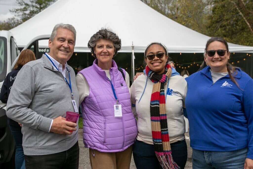 Volunteers and staff stand together at the Volunteer Event 2026