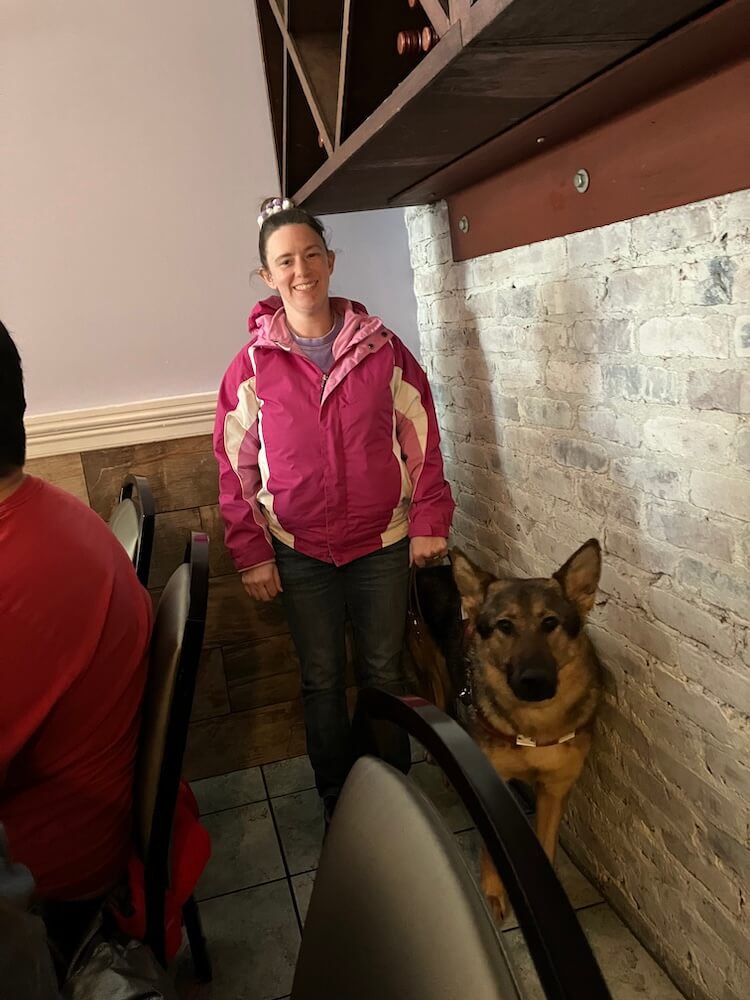 Meagan smiles as she and Rhiana pose in a coffee shop