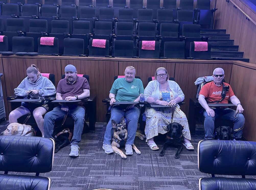 At the Prospector Theater, an accessible outing, the May 5 2026 class prepares for a movie to start with guides quiet on the floor