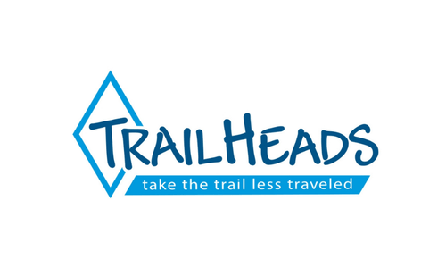 Trailheads in informal font against a small diamond outline in medium blue